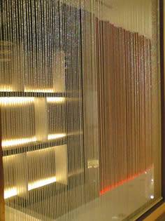 Bead type metallic fabric used as window screen.