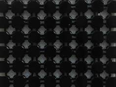A piece of black metallic fabric.