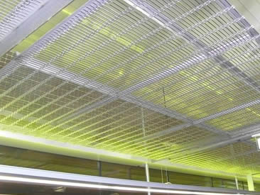 Hanging ceiling is decorated with architectural cable mesh.