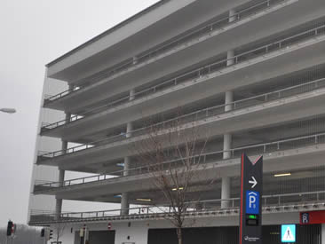 Architectural cable mesh is used in parking lot as corridor balustrade.